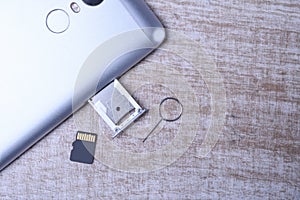 Flash memory data storage concept : A tray with a micro SD card on white background. A memory card is used for storing digital