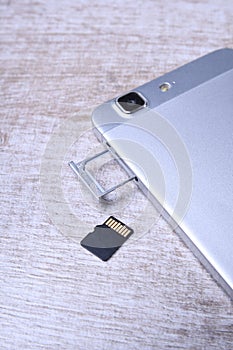 Flash memory data storage concept : A tray with a micro SD card on white background. A memory card is used for storing digital