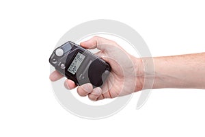 Flash meter in hand on white background