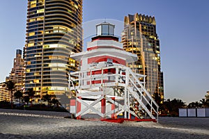 Flash photo of a Miami Beach lifeguard stand with highrise condominiums in background