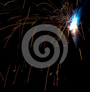 Flash and sparks from electric welding