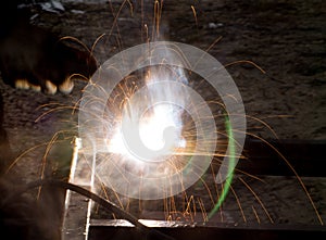 Flash and sparks from electric welding