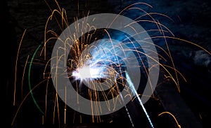 Flash and sparks from electric welding