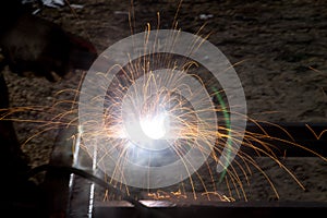 Flash and sparks from electric welding