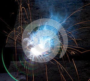 Flash and sparks from electric welding