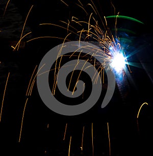 Flash and sparks from electric welding