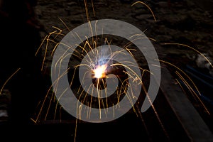 Flash and sparks from electric welding