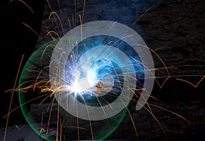 Flash and sparks from electric welding