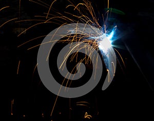 Flash and sparks from electric welding