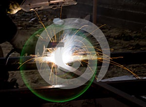 Flash and sparks from electric welding