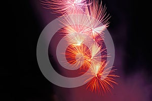 Flashes of pink, red and white fireworks