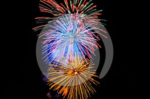 Flashes of yellow blue red and green fireworks