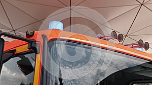 Flashing blue stroboscopic light on roof emergency firefighters vehicle. Fire truck flashing lights.