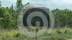 Flashing Roadside Sign Advising Motorists To Drive Safely