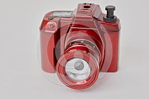 Flashlight made in form of camera on white