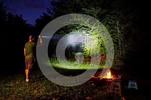 Flashlight in outdoor camping photo