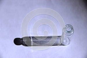 Flask lab glassware equipment. one glass bubbles of white transparent glass with hard shadows against the background of