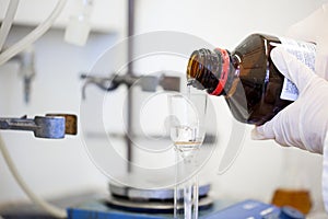 Flasks with liquids in a lab, pharmaceutical industry factory and production laboratory, chemistry concept