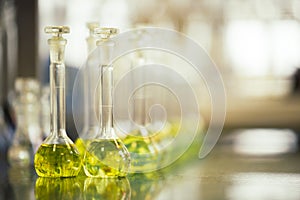 Flasks with liquids in a lab, pharmaceutical industry factory and production laboratory, chemistry concept