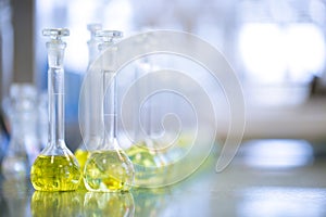 Flasks with liquids in a lab, pharmaceutical industry factory and production laboratory, chemistry concept