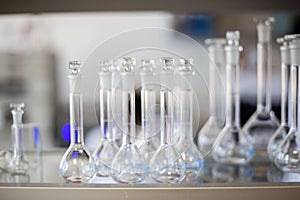 Flasks with liquids in a lab, pharmaceutical industry factory and production laboratory, chemistry concept