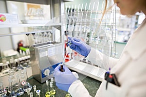 Flasks with liquids in a lab, pharmaceutical industry factory and production laboratory, chemistry concept photo