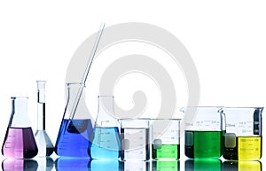 Flasks and measuring beaker for science experiment in laboratory isolated