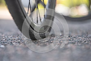 Almost flat bicycle tyre on asphalt..