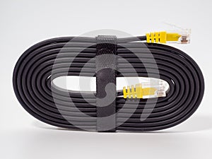 Flat black network cable on a white background.