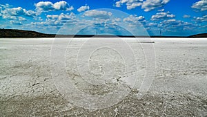 The flat bottom of the dried-up Kuyalnitsky estuary, covered with a layer of white self-precipitating common salt