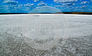 The flat bottom of the dried-up Kuyalnitsky estuary, covered with a layer of white self-precipitating common salt