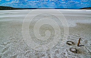 The flat bottom of the dried-up Kuyalnitsky estuary, covered with a layer of white self-precipitating common salt