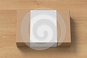 Flat box mock up with blank paper cover label: cardboard gift box on wooden background