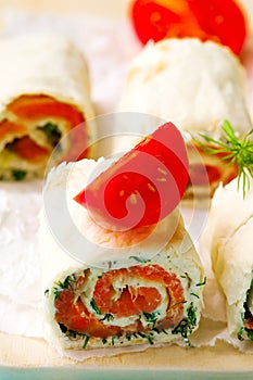 Flat bread roll with cream cheese and salmon