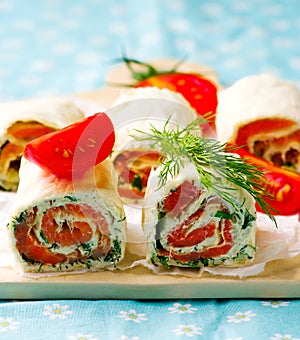 Flat bread roll with cream cheese and salmon