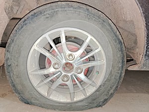 A flat car wheel puntured by a nail