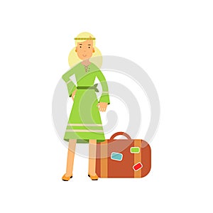 Flat cartoon blonde woman hippie character standing near retro suitcase. Happy flower child female in green dress.