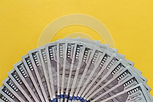Flat closeup of fan dollars on yellow background. Investment profit income. Success concept. Finance investment concept. Dollar