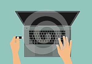 Flat design illustration of gray laptop and hand connecting flash drive to USB, vector