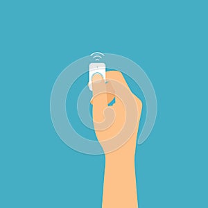 Flat design illustration of a hand holding an infrared remote control. Finger pressed the button, vector