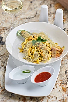 Flat egg noodles with seafood