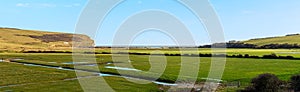 The flat flood plain of the lower reaches of the Cuckemere river in Sussex, UK