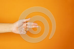 Flat Hand Gesture on Orange Background for Marketing Design photo