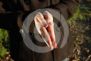 Flat Hands Together with Long Red and Black Fingernails