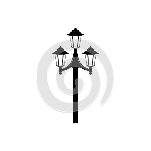 Flat image of latern. Street lamp with three shades on a pole. Street light symbol.