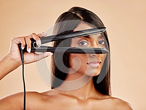 Flat iron, hair and woman with beauty, portrait and hairstyle with appliance isolated on studio background. Keratin