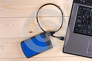Flat lay above lap top computer keyboard and external hard disc with copy space