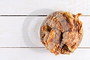 Flat lay above panned steaks in the plate on the wooden planks b