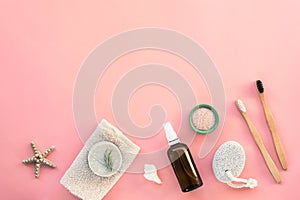 Flat lay accessories for hygiene and body care: soap, pumice stone, toothbrushes, face tonic, himalayan salt
