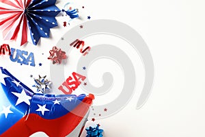 Flat lay American balloon, signs USA, paper fans on white background. 4th of July Independence Day of the USA concept